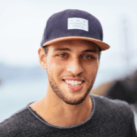 Smiling young man wearing a cap, representing the friendly team behind Star Digital Strategies, emphasizing client-focused digital marketing and website design services.
